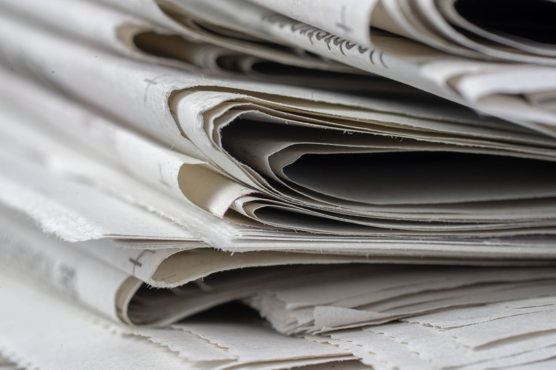 Journalist reading papers and researching stories